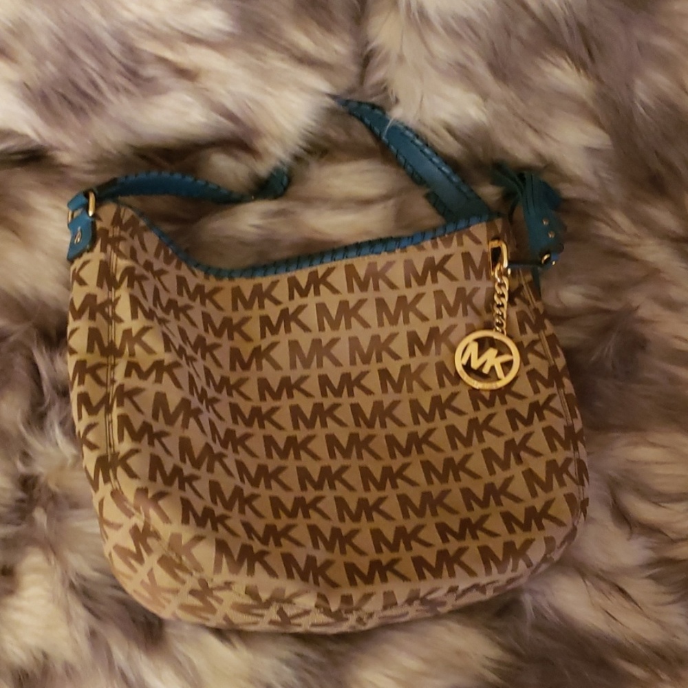 MK bag with teal blue shoulder strap